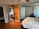 Bright bedroom boasts a full-length mirror, wood accent wall, and ample closet space at 2005 Jackson N St, St Petersburg, FL 33704