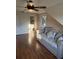 Inviting bedroom features wood paneling, a daybed, and a glimpse into an adjacent bathroom at 2005 Jackson N St, St Petersburg, FL 33704