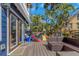 Enjoy the deck with outdoor furniture and a view of the landscaped backyard at 2005 Jackson N St, St Petersburg, FL 33704