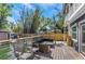 Outdoor deck featuring seating area, fenced yard, and a home in the background at 2005 Jackson N St, St Petersburg, FL 33704