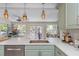 Bright kitchen with stainless steel appliances, white countertops, and view to the backyard at 2005 Jackson N St, St Petersburg, FL 33704