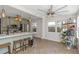 Bright eat-in kitchen with stainless steel appliances, an island with bar stool seating, and oversized tile flooring at 2005 Jackson N St, St Petersburg, FL 33704