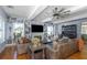 Living room featuring hardwood floors, custom built-in shelves, a fireplace, and plenty of space for entertaining at 2005 Jackson N St, St Petersburg, FL 33704