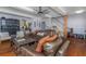 Warm living room with hardwood floors, cozy furnishings, an open layout, and access to the dining and kitchen areas at 2005 Jackson N St, St Petersburg, FL 33704