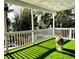 The artificial turf on the porch makes it a lovely outdoor space for relaxing and entertaining at 2005 Jackson N St, St Petersburg, FL 33704