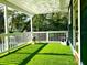 Enjoy the outdoors with the porch's artificial turf and plenty of natural light at 2005 Jackson N St, St Petersburg, FL 33704