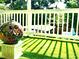 The porch features artificial turf and provides a private outdoor space for enjoyment at 2005 Jackson N St, St Petersburg, FL 33704