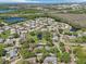 Expansive aerial shot captures a residential neighborhood with ponds, green spaces, and convenient highway access at 2009 Halidom Way, Sun City Center, FL 33573
