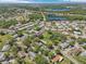 Wide angle showcases a community featuring tranquil ponds, lush greenery, and peaceful residential homes at 2009 Halidom Way, Sun City Center, FL 33573