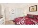 Comfortable bedroom featuring built-in closet and neutral-toned carpet at 2009 Halidom Way, Sun City Center, FL 33573