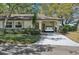 Charming single-story home featuring a covered carport and manicured landscaping at 2009 Halidom Way, Sun City Center, FL 33573