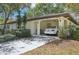 Inviting single-story home with a covered carport and well-maintained front yard at 2009 Halidom Way, Sun City Center, FL 33573