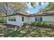 Well-maintained exterior with large windows and manicured landscaping at 2009 Halidom Way, Sun City Center, FL 33573