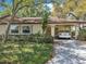 Charming home with a carport and well-manicured front yard at 2009 Halidom Way, Sun City Center, FL 33573