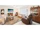 Cozy living room with plush seating, entertainment center, and bright natural light at 2009 Halidom Way, Sun City Center, FL 33573