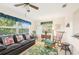 Bright living room with large windows, comfortable seating, and stylish decor at 2009 Halidom Way, Sun City Center, FL 33573