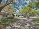 Quiet, tree-lined street with well-kept homes and mature landscaping at 2009 Halidom Way, Sun City Center, FL 33573