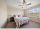 Bedroom with a ceiling fan, carpeted floors, and a window with blinds at 2011 Hawks View Dr, Ruskin, FL 33570