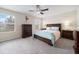 Main bedroom with a ceiling fan, neutral walls, and carpeted floors at 2011 Hawks View Dr, Ruskin, FL 33570