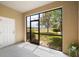 Screened-in patio with view of backyard, lake, and neighborhood, providing a peaceful outdoor space at 2011 Hawks View Dr, Ruskin, FL 33570