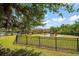 View of the community playground with a swing set, slide, and a bench for relaxing at 2011 Hawks View Dr, Ruskin, FL 33570