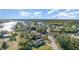 Picturesque view of a home nestled among lush greenery and sparkling waterways, creating an idyllic and inviting scene at 311 Ravenna N St, Nokomis, FL 34275