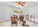 Bright dining room offering sunny windows and natural light, with versatile design at 311 Ravenna N St, Nokomis, FL 34275