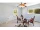 Dining room featuring a bright and airy space with three sunny windows at 311 Ravenna N St, Nokomis, FL 34275