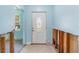 Entryway to home, with aqua walls and damaged trim at 311 Ravenna N St, Nokomis, FL 34275
