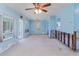 Spacious living room with aqua walls and damaged trim at 311 Ravenna N St, Nokomis, FL 34275