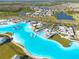 The resort-style community features a lagoon, beach, and clubhouse, all designed for an exceptional living experience at 31399 Penny Surf Loop, Wesley Chapel, FL 33545