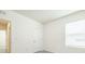 Bright, neutral bedroom with a window and closet door at 31399 Penny Surf Loop, Wesley Chapel, FL 33545