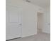 Bright bedroom with gray carpet; emphasis on size of room and neutral color palette at 31399 Penny Surf Loop, Wesley Chapel, FL 33545