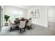 Dining room featuring modern furnishings and natural light from the windows at 31399 Penny Surf Loop, Wesley Chapel, FL 33545