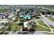 Aerial view of community featuring a swimming pool, a basketball court and a recreational area at 31730 Spoonflower Cir, Wesley Chapel, FL 33545