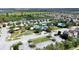 An aerial view of the community featuring a swimming pool, park and recreation area at 31730 Spoonflower Cir, Wesley Chapel, FL 33545