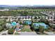 Aerial view of the community's pools, tennis courts, and well-maintained landscaping at 31730 Spoonflower Cir, Wesley Chapel, FL 33545