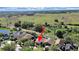Aerial view of the home backing to a conservation area with green foliage at 31730 Spoonflower Cir, Wesley Chapel, FL 33545