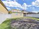 Backyard with a white fence at 31730 Spoonflower Cir, Wesley Chapel, FL 33545