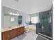Bright bathroom with double vanity, soaking tub, and tiled glass-enclosed shower at 31730 Spoonflower Cir, Wesley Chapel, FL 33545