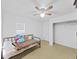 Simple bedroom with a ceiling fan, closet space, and one window at 31730 Spoonflower Cir, Wesley Chapel, FL 33545