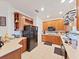 Kitchen with wood cabinets and white countertops at 31730 Spoonflower Cir, Wesley Chapel, FL 33545