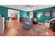 Inviting living room with a ceiling fan and open view to dining room at 31730 Spoonflower Cir, Wesley Chapel, FL 33545