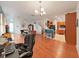 Open concept living space showcasing the dining area, kitchen, and stairs at 31730 Spoonflower Cir, Wesley Chapel, FL 33545