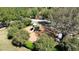 Aerial view of community playground with modern play equipment and surrounding greenery at 31730 Spoonflower Cir, Wesley Chapel, FL 33545