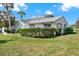 Home exterior with well-manicured lawn, trimmed hedges, and a white exterior at 3268 39Th S St # A, St Petersburg, FL 33711