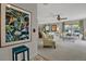 Cozy living room featuring floral patterned sofas, neutral walls, and ample natural light streaming through large windows at 3268 39Th S St # A, St Petersburg, FL 33711