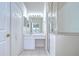 Bright bathroom with a glass-enclosed shower, a vanity with ample counter space, and tile flooring at 34907 Double Eagle Ct, Zephyrhills, FL 33541