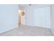 A charming bedroom features neutral walls and trim and a double closet at 34907 Double Eagle Ct, Zephyrhills, FL 33541