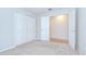Comfortable bedroom with neutral carpet and trim, and a double door closet at 34907 Double Eagle Ct, Zephyrhills, FL 33541
